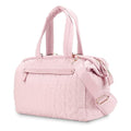 Pink quilted handbag with a strap on a white background